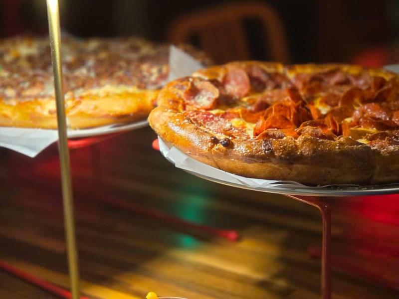 Pizzas and a drink.