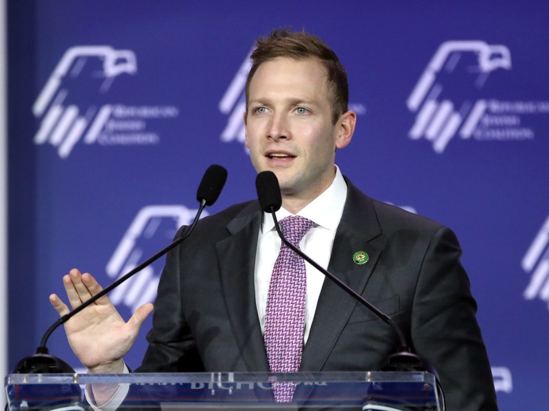 A man speaking at a podium