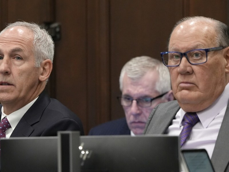 Two men in a courtroom.