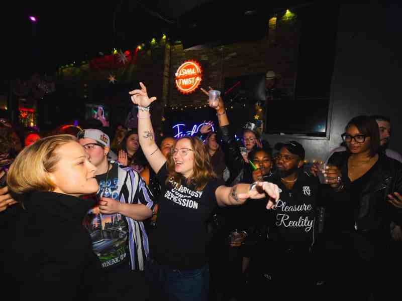 A group of people at a bar.