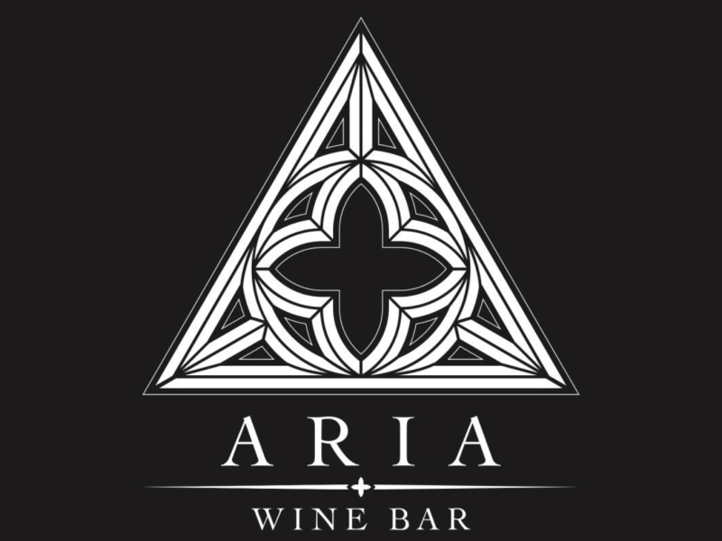 A black background with Aria Wine Bar in white font.
